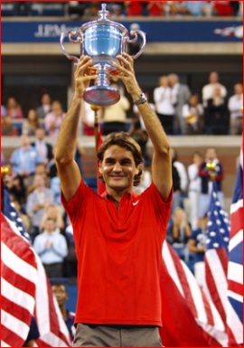 Roger Federer proudly poses with his trophy after winning the 2008 Men's US Open Final.